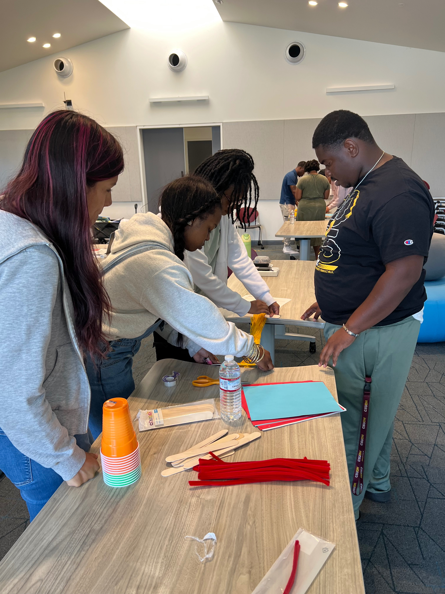 Tristan Castillo participating in a team-building activity with TVI Rise fellows during the pilot Summer Institute.