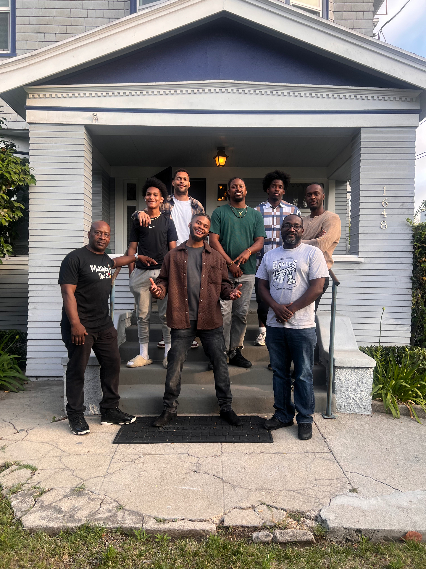Watts of Power fellows gathered outside a WOPF teacher house during the filming of Penciled with Power.
